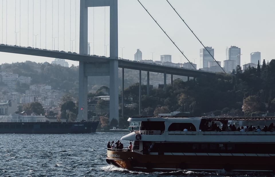 A tour boat on the Bosphorus, the bridge behind